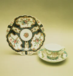 Worcester porcelain plate with scale blue decoration, 1768; teacup and saucer with hop trellis-work decoration, c.1770